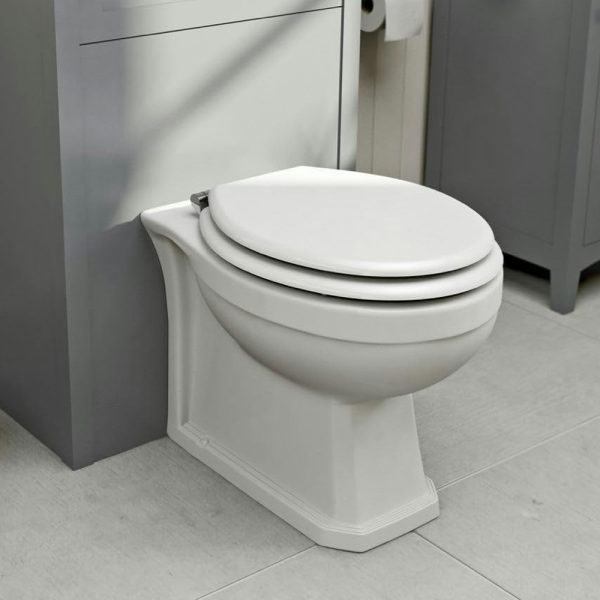 The Bath Co. Camberley Back To wall Toilet with White Wooden Seat